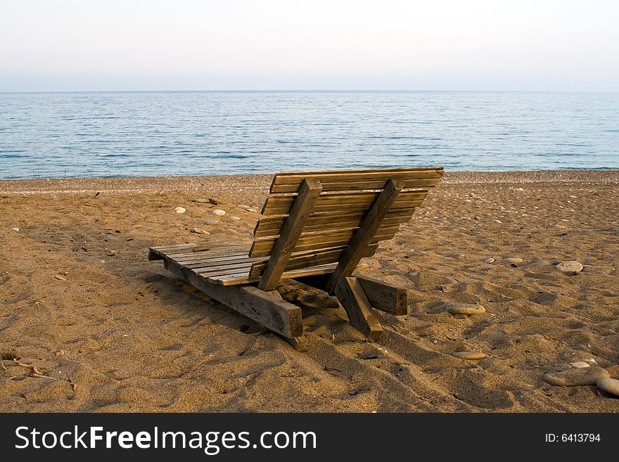 Wooden deck chair on the beach, in Cirali