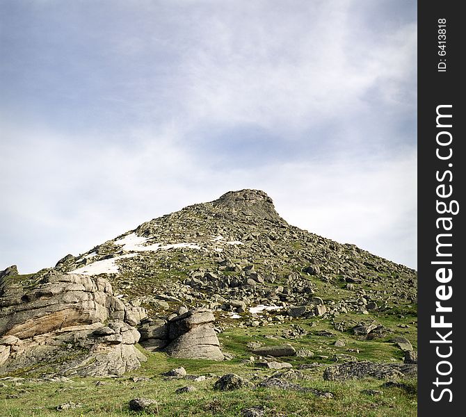 High mountain's rocks, summer, sky and clouds. High mountain's rocks, summer, sky and clouds