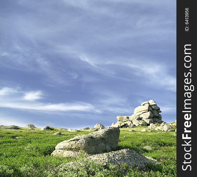 High mountain's rocks, summer, sky and clouds. High mountain's rocks, summer, sky and clouds