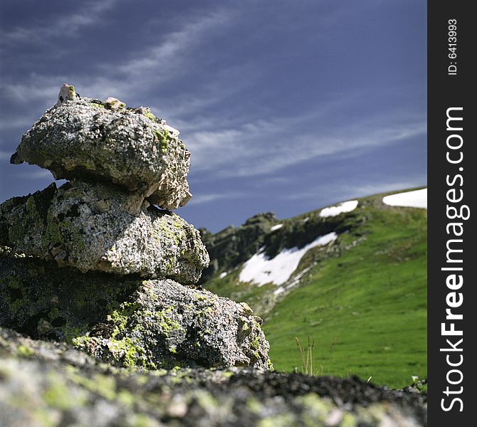 High mountain's rocks, summer, sky and clouds. High mountain's rocks, summer, sky and clouds