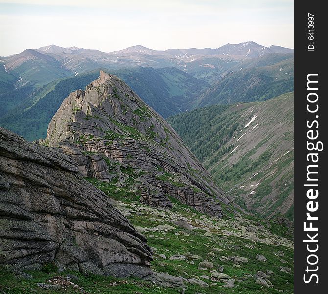 High mountain's rocks, summer, sky and clouds. High mountain's rocks, summer, sky and clouds