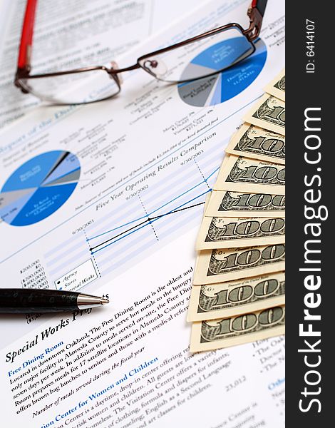 A pair of glasses on top of a financial report.