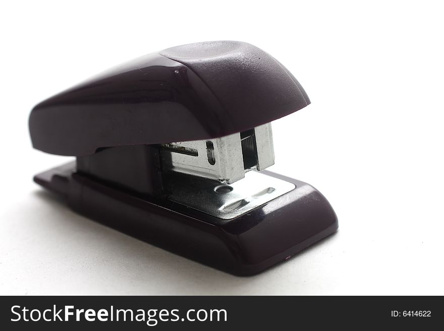 Isolated shot of a small black stapler on white