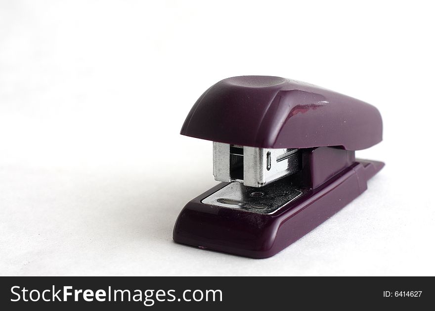 Isolated shot of a small black stapler on white