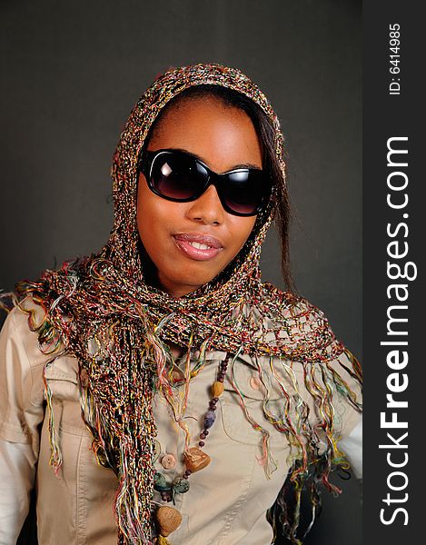 Portrait of young african female model posing with sunglasses. Portrait of young african female model posing with sunglasses