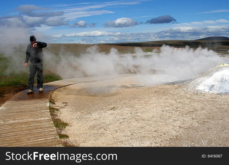 A researcher mext to the fumarole. A researcher mext to the fumarole