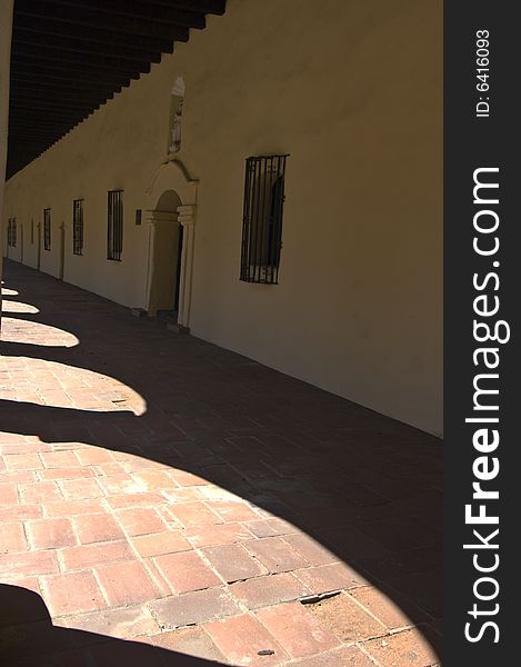 Shadows cast by the arches of the long building of Mission San Fernando, California. Shadows cast by the arches of the long building of Mission San Fernando, California.