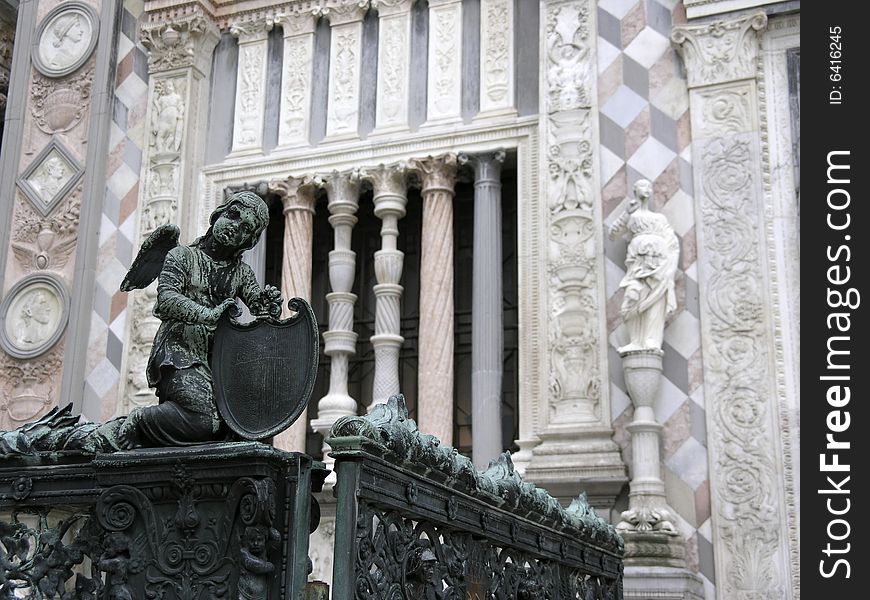 Little angel sculpture in front of main cathedral in Bergamo, Italy.