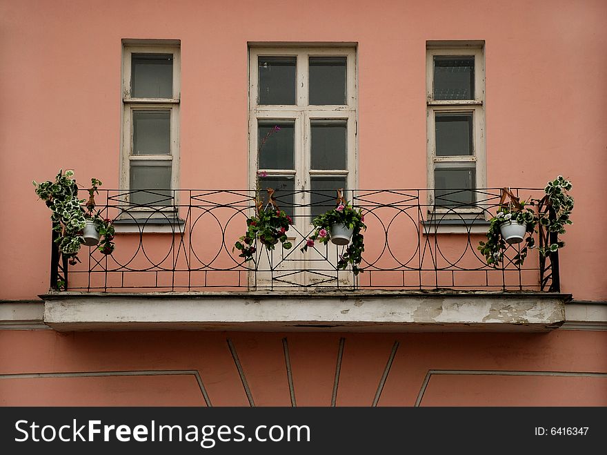 Balcony with flowers and windows