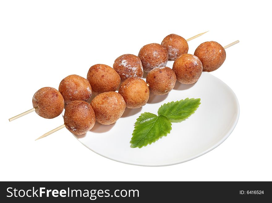 Isolated doughnuts balls on bamboo stick. Isolated doughnuts balls on bamboo stick