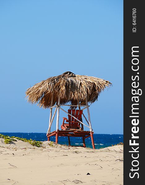 A view of rustic chair on tropical beach scene. A view of rustic chair on tropical beach scene