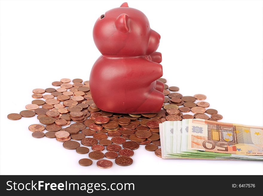 Red Piggy Bank isolated on white background with coins and euro banknotes. Red Piggy Bank isolated on white background with coins and euro banknotes