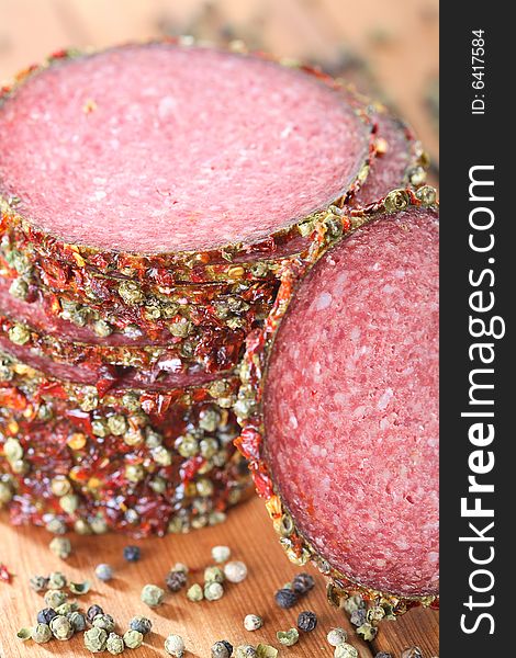 Tasty salami with pepper grains and spice. Tasty salami with pepper grains and spice