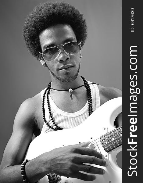 Portrait of young african man playing electric guitar. Portrait of young african man playing electric guitar