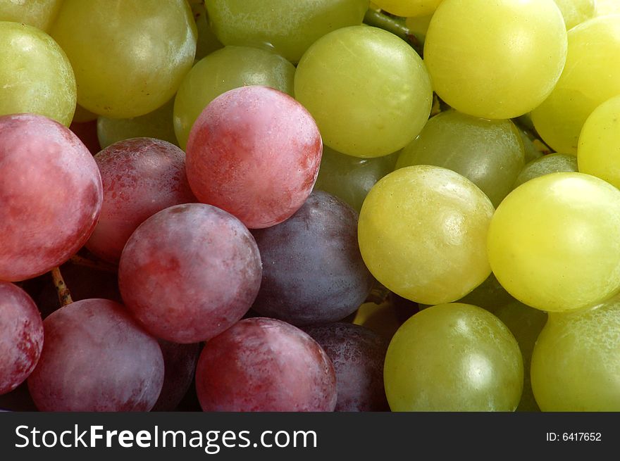 Bunch of fresh grapes with leaf isolated on white