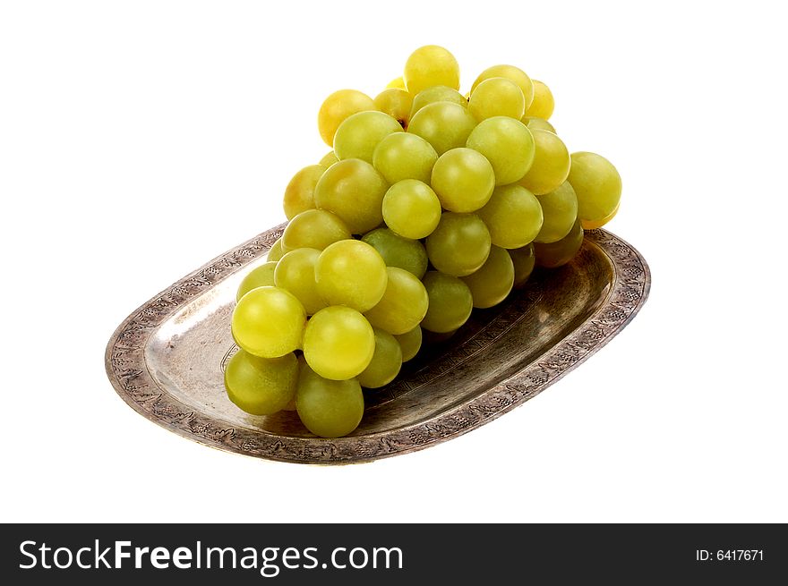 Bunch of fresh grapes with leaf isolated on white