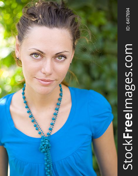 Smiling woman with blue beads. Smiling woman with blue beads