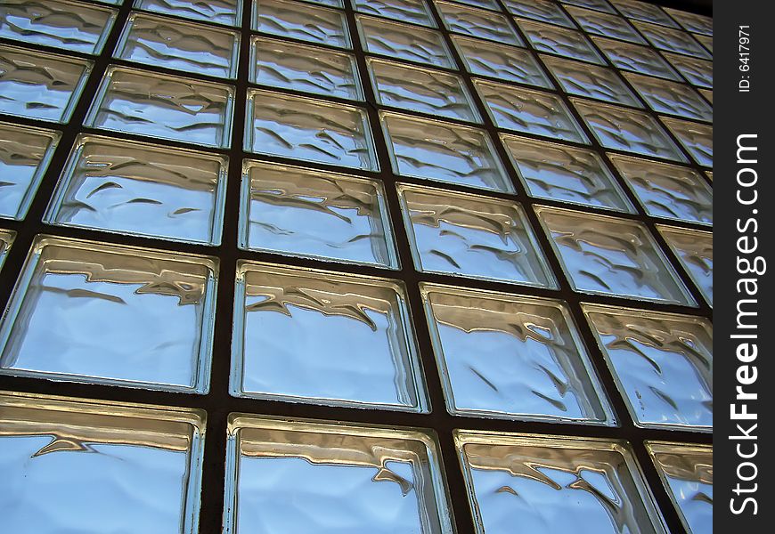 Perspective of a glass bricks wall distorting light. Perspective of a glass bricks wall distorting light