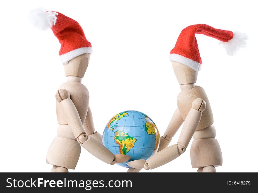 Two little wooden men with globe on a white background