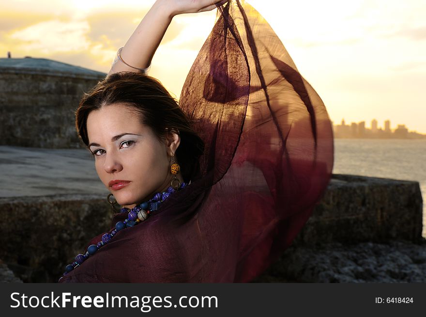 Portrait of young famale fashion model posing outdoors. Portrait of young famale fashion model posing outdoors