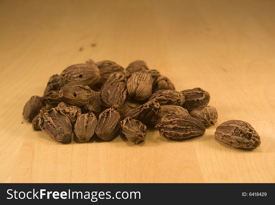 Black cardamom fruits on burlap