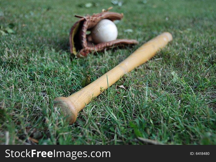 Photo of baseball bat with glove