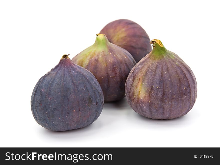 Many ripe,freshly figs on the white background.