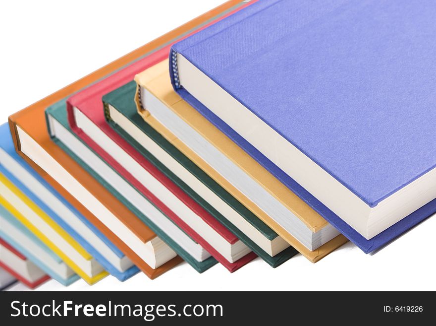Stacked books on white background