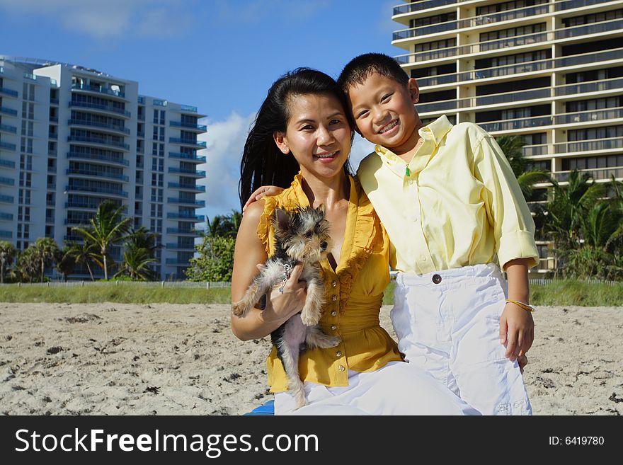 Mother and her son smiling at the beach. Mother and her son smiling at the beach