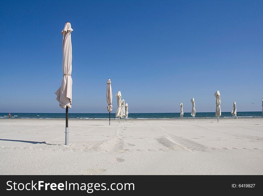 White umbrellas on the beach