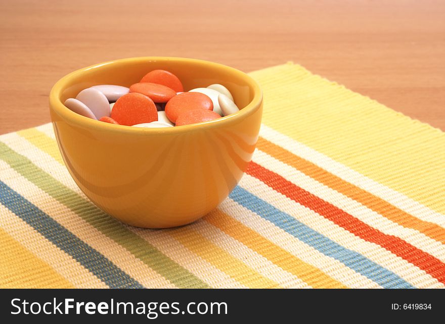 Colorful Candy In Yellow Bowl