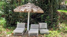 Thatched Umbrella And Chairs Royalty Free Stock Photography