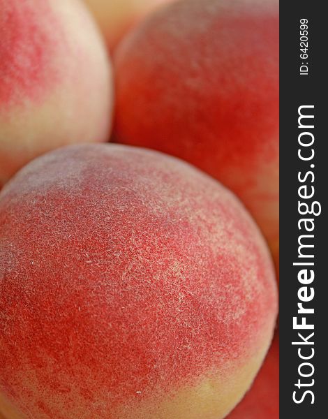 Close up of the fresh ripe peaches.