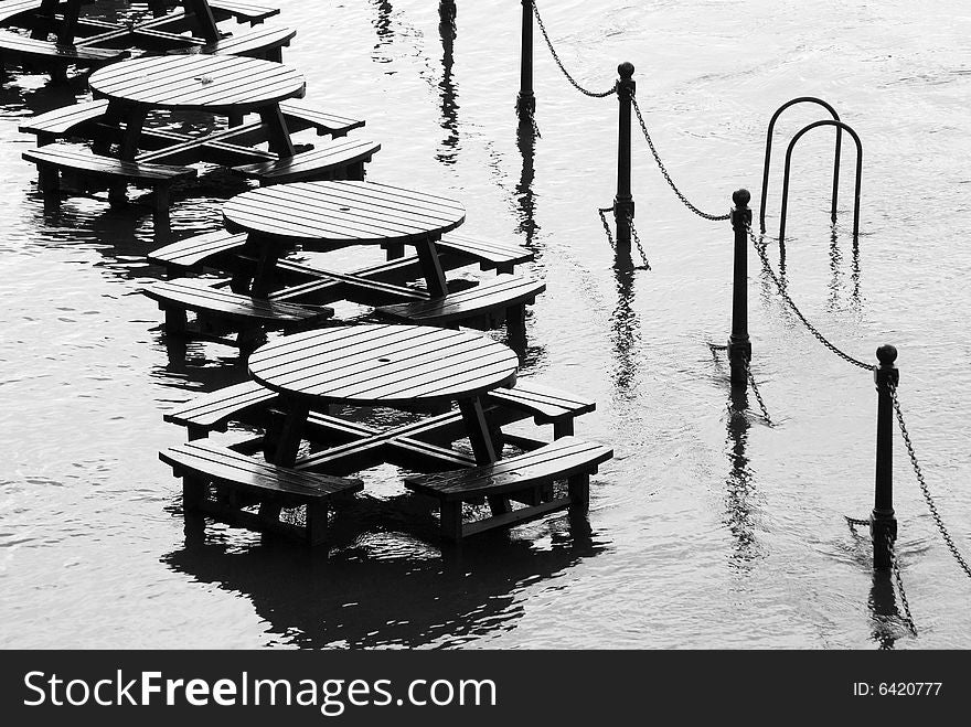 Flooded tables on bank of River Ouse in York. Flooded tables on bank of River Ouse in York.