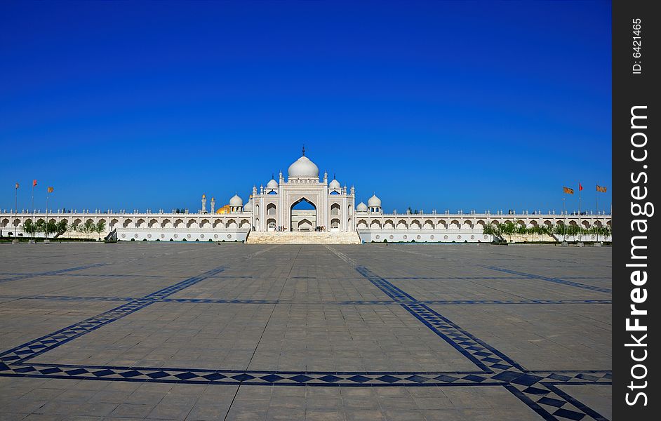 A modern mosque square under blue sky