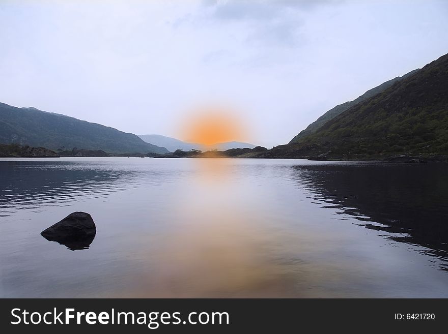 Scenic view of a killarney lake at sunset. Scenic view of a killarney lake at sunset