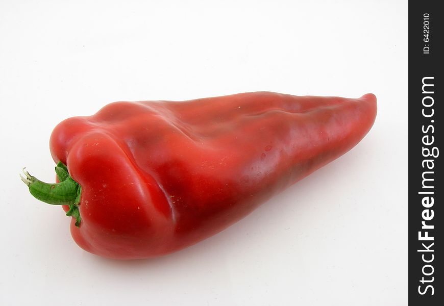 Fresh picked red pepper isolated over white background.