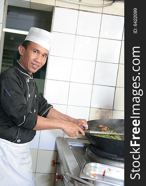 Chef cooking at kitchen