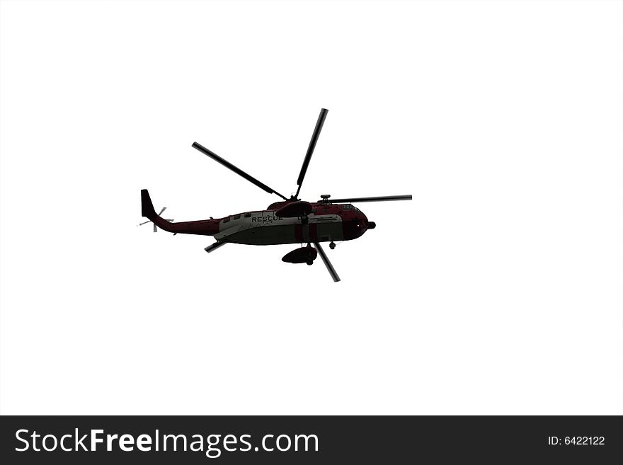 A helicopter on a life air sea rescue mission on a white background. A helicopter on a life air sea rescue mission on a white background