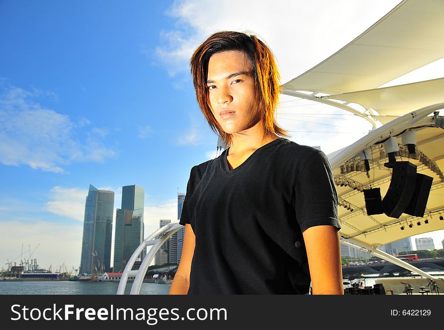 Picture of a long hair youth, rebellious and ready to rock. Useful for illustrating youths in society and Generation Z. Picture of a long hair youth, rebellious and ready to rock. Useful for illustrating youths in society and Generation Z.