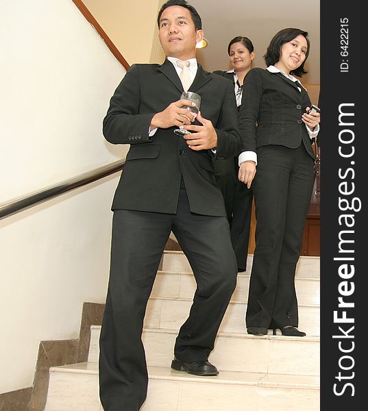 Three business people in pose
