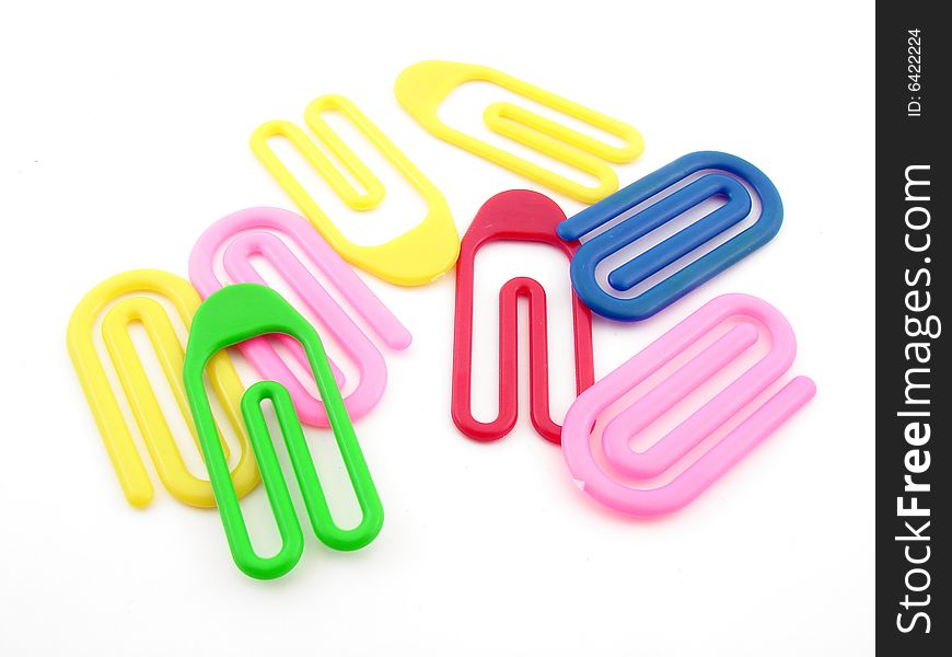 Colorful plastic paper clips isolated over white background.