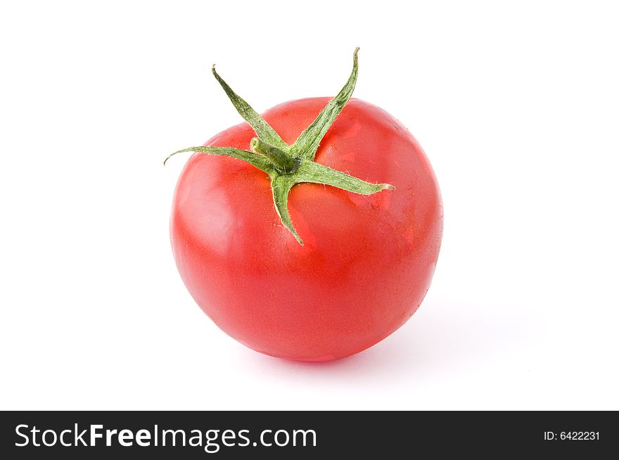 Fresh and ripe tomato isolated on white background. Professional studio image. Fresh and ripe tomato isolated on white background. Professional studio image