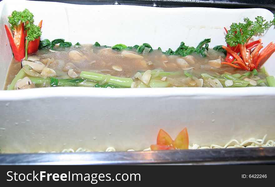 Photograph of soup in rectangular bowl in buffet. Photograph of soup in rectangular bowl in buffet