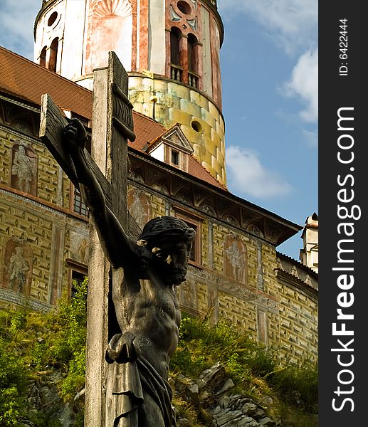 Jesus Christ sculpture on the cross behind Cesky Krumlov castle. Jesus Christ sculpture on the cross behind Cesky Krumlov castle.