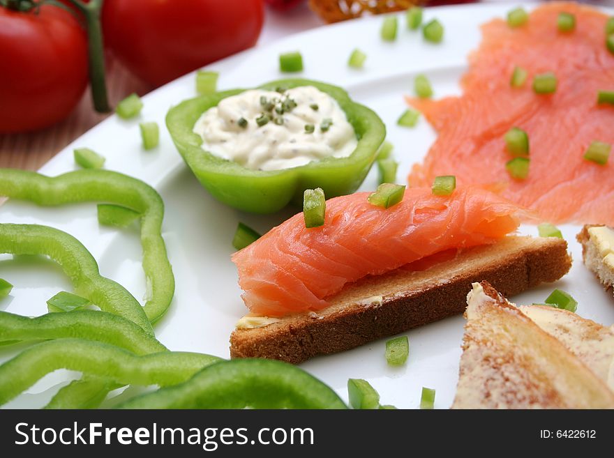 A breakfast of fresh salmon and some bread. A breakfast of fresh salmon and some bread