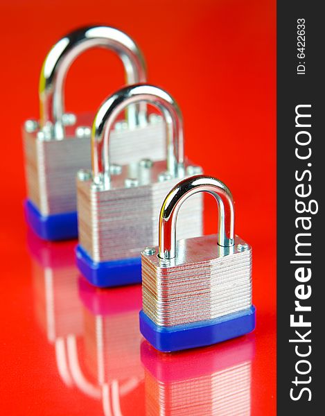 Padlocks isolated against a red background