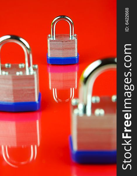 Padlocks isolated against a red background