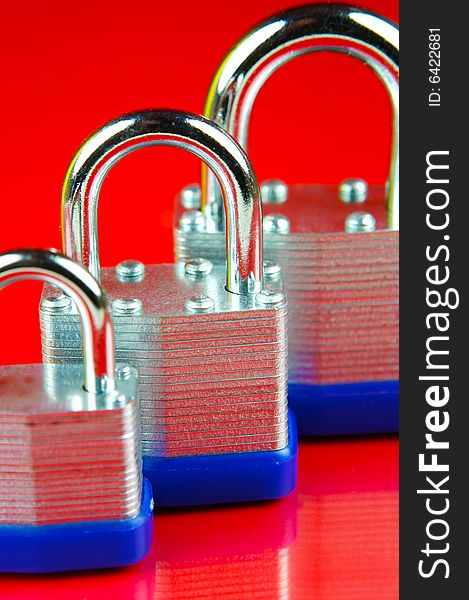 Padlocks isolated against a red background