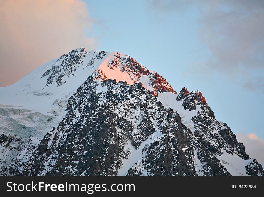 Mountain peak at sunset. Siberia, Altai mountains, Russia